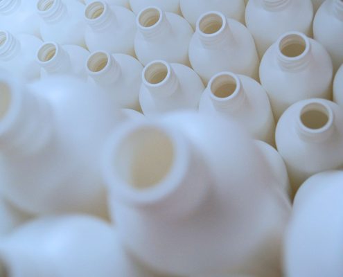 Close up of white plastic cylinder bottles
